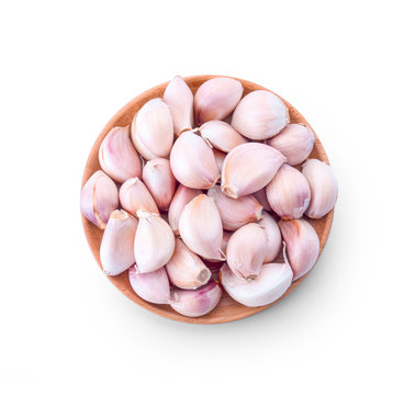 wood bowl with garlic on white background
