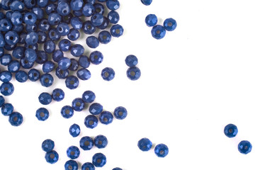 close up multi colored beads heap isolated on white