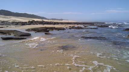 Südafrika Küstenlandschaft mit Sand und Felsen