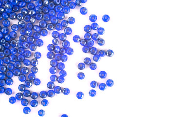 close up multi colored beads heap isolated on white