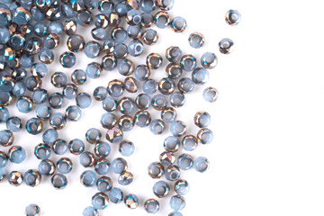 close up multi colored beads heap isolated on white