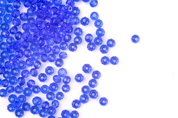 close up multi colored beads heap isolated on white