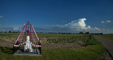 Lonely chapel standing at a crossroads - 331740551