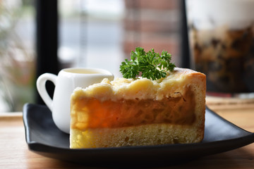 Close-up view Cheesecake on black dish, Snacks for free time or breaks.