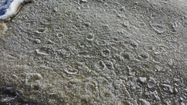 Aerial view of an ice texture floating on the waves of the Gulf of Finland