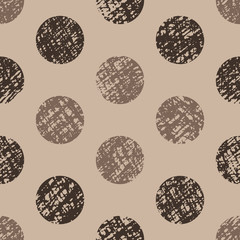 Seamless pattern, hand-drawn circles of brown color on a beige background. Polka dot pattern.  Stylish design. Vector.