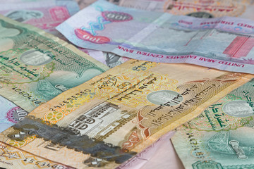 currency of United arab Emirates: heap of dirhams banknotes