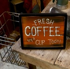 Close up view of fresh coffee available sign