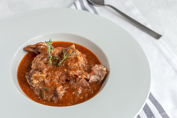 Lamb stew with aromatic herbs seen from above
