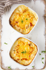 Casserole with a golden crust , mushroom julienne with baked cheese, creamy gratin.