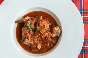 Lamb stew with aromatic herbs seen from above