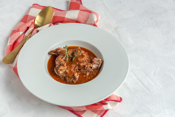 Lamb stew with aromatic herbs seen from above