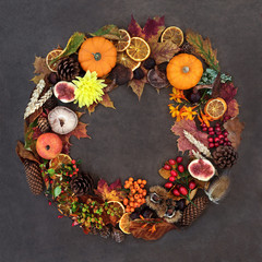 Autumn harvest festival wreath composition with a variety of natural flora, fauna and food on lokta...