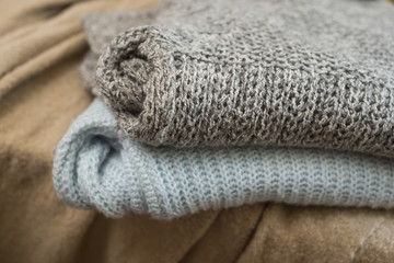 Closeup of woolen pullover stacked at home
