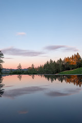 Obraz premium Sunset over vineyard and infinity pool - red clouds - Napa