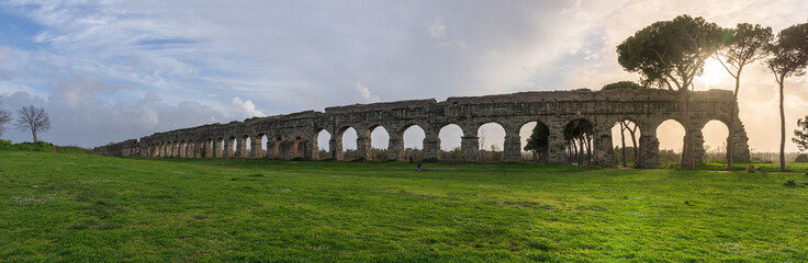 Fototapeta na wymiar Ruins of Roman aqueduct Aqua Claudia in Parco degli Acquedotti park, Rome, Italy