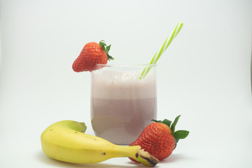 Strawberry  and banana smoothie in a glass cup. Highly recommended drink for our health. It is a very healthy bedida.