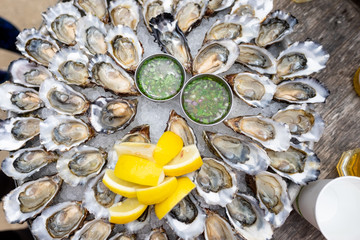 50 Oysters on a platter - with lemons and vinaigrette