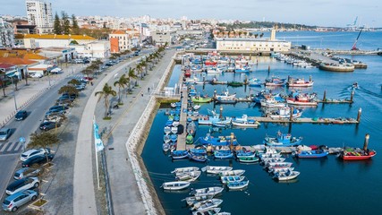 Fototapeta na wymiar Aerial view of fishermen's wharf, in Setúbal, Portugal. Fishing boats in Setúbal.