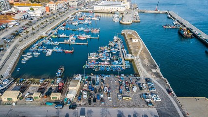 Fototapeta na wymiar Aerial view of fishermen's wharf, in Setúbal, Portugal. Fishing boats in Setúbal.