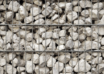 Gabion wall constructed with steel cage and crushed limestone rock