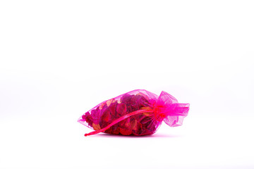 Fragrant herbs, deodorant in Thai pink bags, white background and isolated