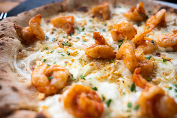 White pizza, with shrimp and onion on top