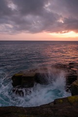 Sunset over pacific ocean - dark days - island in background