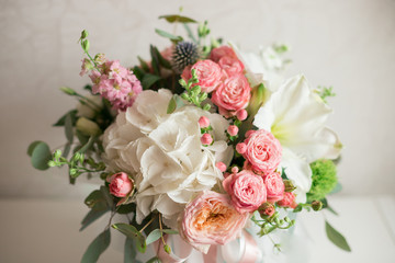A large flower arrangement in a hat box was created by a florist for a wedding gift. Hydrangea,...