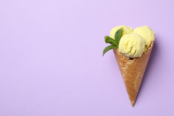 Ice cream on violet background, space for text