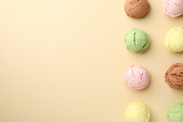 Ice creams balls on beige background, top view