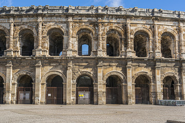 Obraz premium Ancient Nimes Roman Amphitheatre. Nimes Arena (70 CE) - one of the best-preserved amphitheaters in the world. Nimes, Occitanie region of southern France.