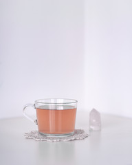 tea with crystal on doily