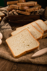 Slices of white bread and brown bread in box