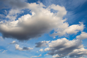 sky with clouds on a bright blue background
