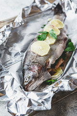 Raw rainbow trout in foil