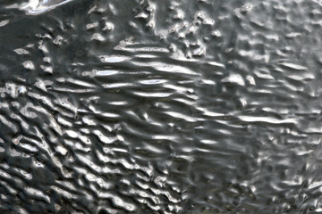 Beautiful background from a metal base, stainless metal of different shapes.