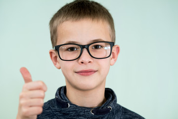 Close up portrait of a child school boy wearing glasses.