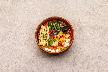 Traditional Korean spicy soup with kimchi, tofu, vegetables. Hot dish for healthy meal