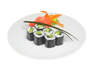 Sushi rolls with cucumber, seeds and nori on white round plate