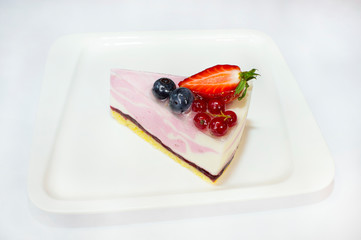 Curd cake with currant, strawberries, blueberries