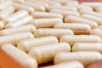 a pill to fight viruses that are isolated against a white background and copy space, macrocapsule drugs to fight viruses that are isolated against a white background and copy space, macro