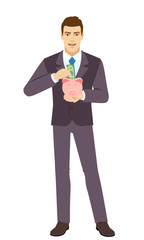 Smiling Businessman puts banknote in a piggy bank. Full length portrait of Businessman in a flat style.