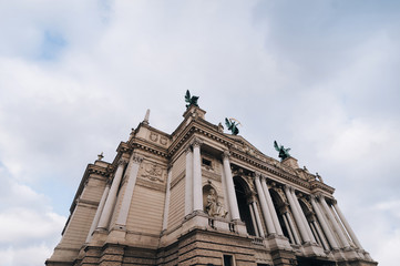 Obraz premium Fasade of Lviv theatre of opera and ballet. The central sculpture on roof is Glory, left one is Music, right figure is Comedy and Drama. Copy space.