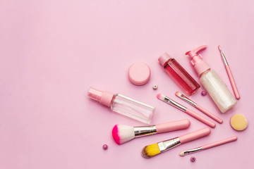 Obraz na płótnie Canvas Makeup cosmetic set on pink background