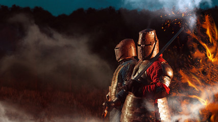 Two Medieval knights armed with axe and sword.
