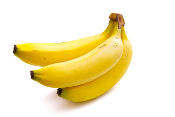 a bright yellow ripe banana isolated from a white background and copy space