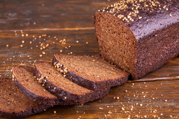 Black bread, served with sliced pieces with seasonings and tmina