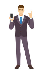 Smiling Businessman holding mobile phone and pointing up. Full length portrait of Businessman in a flat style.