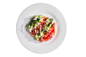 Spring salad of cucumbers, tomato, onions and sauce